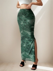 Detail of high waist slit maxi skirt with artistic abstract dark green print
