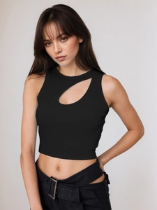 Detailed close-up of black ribbed knit crop top featuring asymmetric cutout neckline