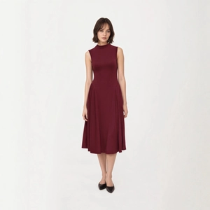 Detail of burgundy sleeveless midi dress with high neck and ribbed knit texture