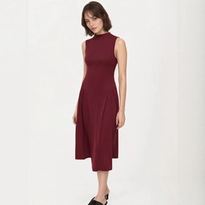 Detail of wine red mock neck sleeveless dress with elegant pleated midi A-line skirt