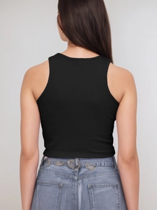 Back view of sexy ribbed black crop top tank for women paired with denim jeans