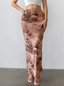 Detailed view of women's printed maxi skirt with side slit and satin-like finish