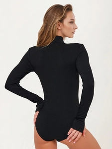 Close-up of black long-sleeve ribbed bodysuit showing detailed knit texture and back fit
