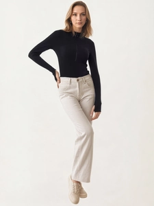 Chic black long sleeve bodysuit with thumbholes paired with corduroy flare pants