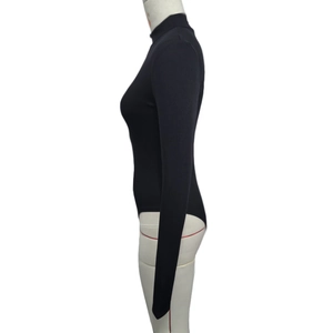 Detail of black rib-knit long sleeve bodysuit with high neck on white mannequin