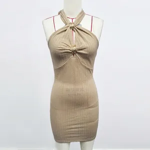 Detail of khaki ribbed knit dress with neck cut-outs and golden metal rings