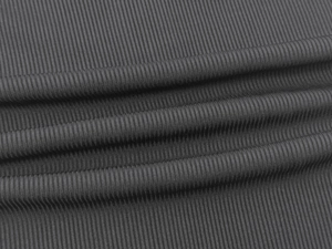 Macro shot of dark grey ribbed knit fabric showing fine vertical texture and soft folds