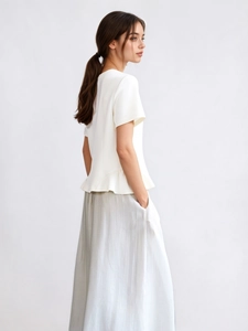 White short-sleeve T-shirt with ruffle hem and elegant silhouette for summer wear
