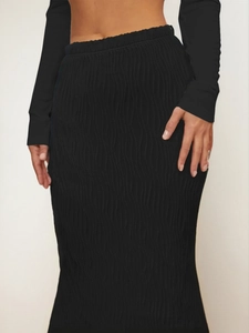 Elegant high-waisted black mermaid skirt with textured ripple fabric and slim fit design