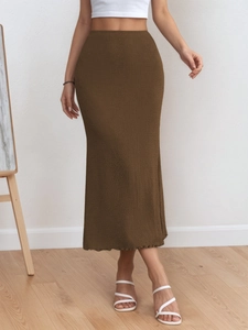 Elegant brown high-waist knit maxi skirt with textured finish and bodycon fishtail hem