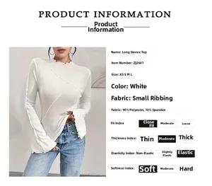 Detail of white slim fit knit top featuring ruffled wave collar and flared cuffs texture