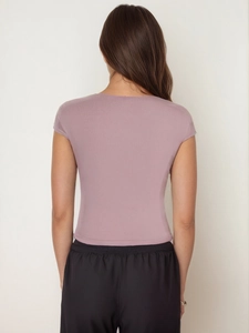 Slim fit cropped short sleeve T-shirt in dusty pink featuring a stylish lace-up back design