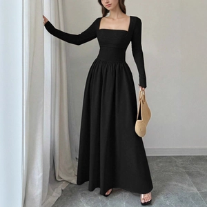Detail of elegant square neck black long sleeve dress with slim waist and A-line pleated skirt
