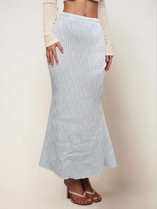 Close-up of light blue pleated long skirt with wavy texture and elastic high waistband