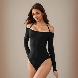 Detail of black off-shoulder bodysuit with halter straps and long sleeves in slim fit