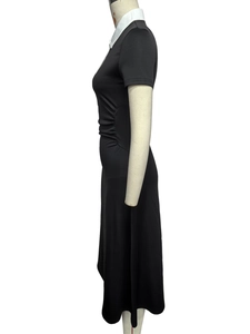 Detail of waist pleats and contrast white Peter Pan collar on a black short sleeve dress