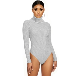 Detailed close-up of light grey ribbed knit texture on long sleeve turtleneck bodysuit