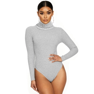 Detail showing light grey ribbed knit fabric and high neckline of the long sleeve bodysuit