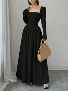 Elegant black square neck long sleeve dress with slim fit waist and a-line flowing hemline