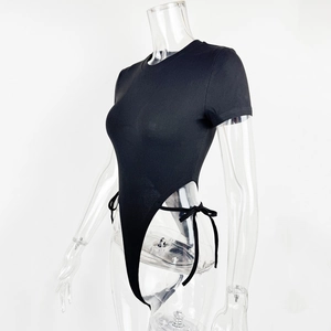 Close-up of ribbed black bodysuit featuring side cut-outs and lace-up ribbon details