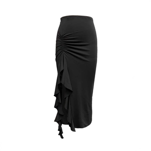 Detail of high waist black skirt featuring side ruffles and asymmetrical split hem