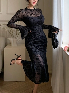 Elegant black lace flared sleeve fishtail dress with floral flocking mesh details