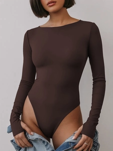 Detailed fit of a long sleeve dark brown bodysuit styled with light blue denim jeans