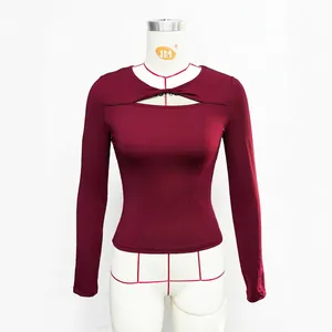 Detail of front cutout design and slim fit cut on long sleeve dark red T-shirt