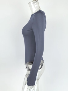 Side view of dark charcoal long sleeve bodysuit with crew neck on a clear model