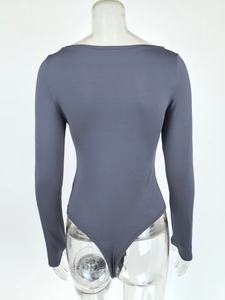 Detail of grey long sleeve off-shoulder bodysuit with slim fit and high-cut leg