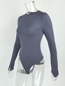 Detail view of grey long-sleeve bodysuit featuring thumbhole cuffs and a slim-fit round neck