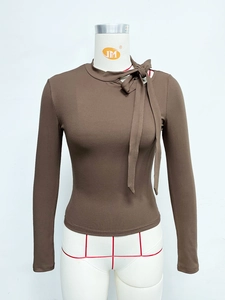 Deep brown ribbed knit long sleeve top with elegant bow-tie neck design for women
