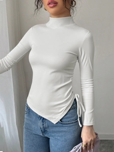 Slim fit white mock neck top for women featuring side drawstring and asymmetric hem