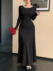 Elegant black slim-fit long sleeve maxi dress with round neck and backless lace detail