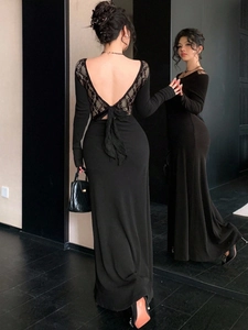 Slim fit black long sleeve dress with backless lace details and a chiffon bow tie