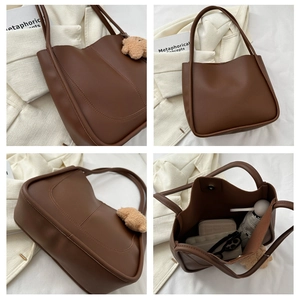 Detailed views of a large brown tote bag with plush bear charm and spacious interior