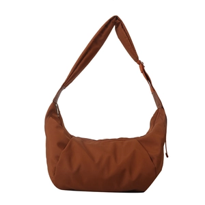 Minimalist caramel brown nylon crescent crossbody bag with adjustable wide strap