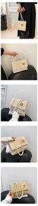 Détail du sac à bandoulière en paille tissée à la main avec applique de marguerite blanche