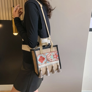 Ethnic bohemian canvas tote bag with floral embroidery and tassel fringe details