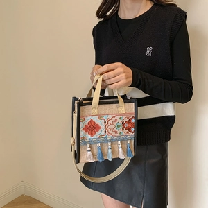Ethnic style embroidered linen tote bag with tassels and shoulder strap for women