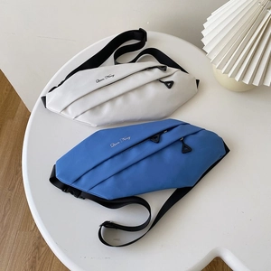 Close-up of minimalist sports waist bags with black straps and Qian Ning lettering