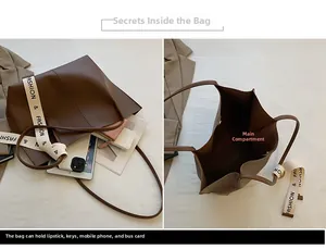 Detail view of large dark brown tote bag interior and fashion strap storage capacity