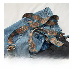 Detail of adjustable bohemian geometric pattern wide strap for crossbody tote bag
