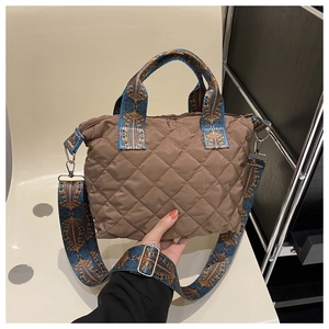 Brown quilted nylon tote bag featuring a colorful bohemian embroidered wide shoulder strap