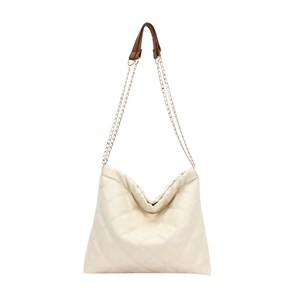 Quilted cream hobo bag with gold chain strap and brown leather padding on white background