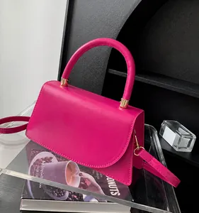 Chic rose red small crossbody bag with gold hardware and curved top handle for women