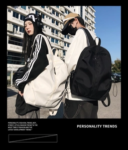 Outdoor shot of minimalist black and beige large capacity backpacks for couples