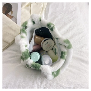 Top view of plush green and white floral tote bag showing spacious interior storage