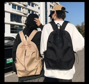 Outdoor shot of minimalist large capacity couple backpacks in black and khaki colors