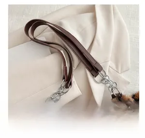 Close-up of leopard print faux fur tote bag with brown leather strap and silver chain
